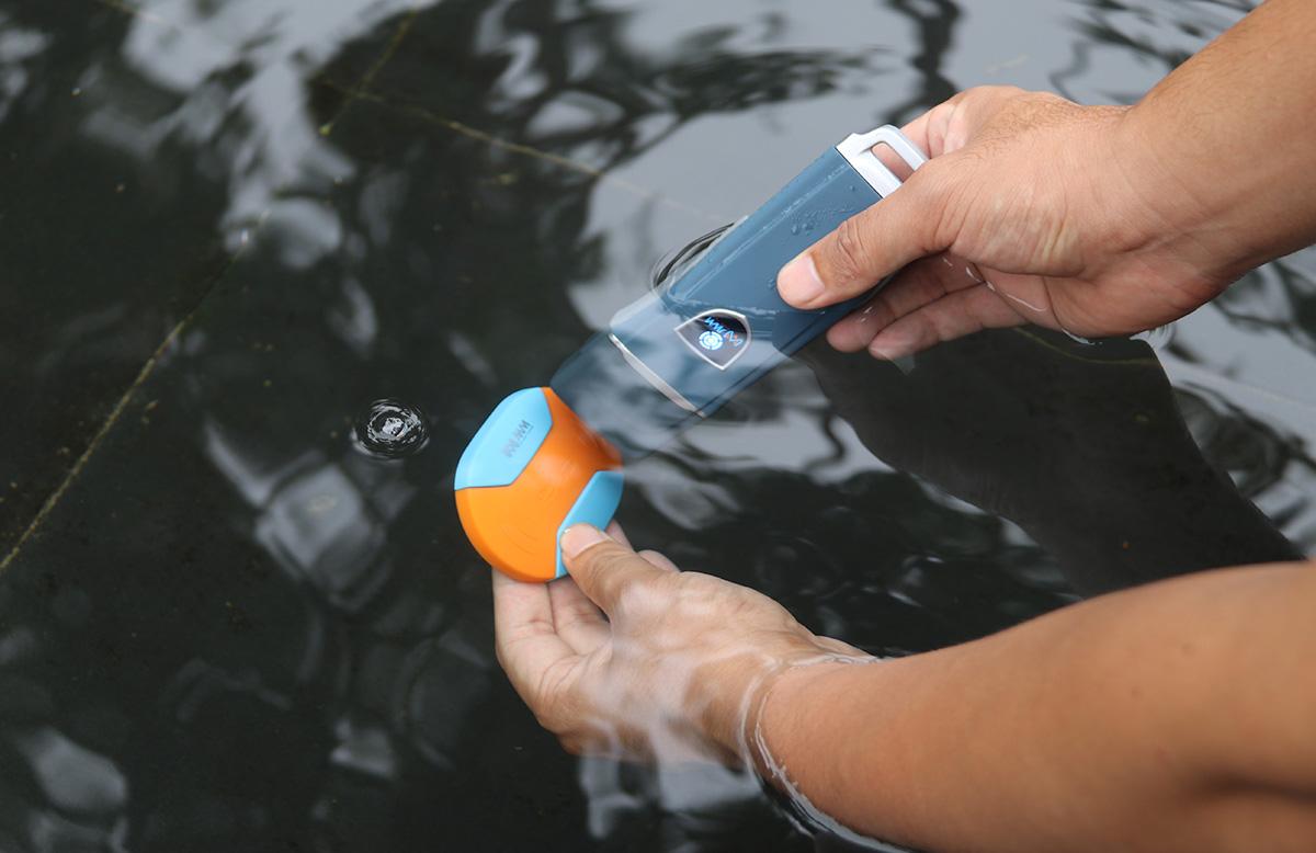 JWM device partially submerged in water